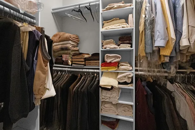 a close up view of walk in closet
