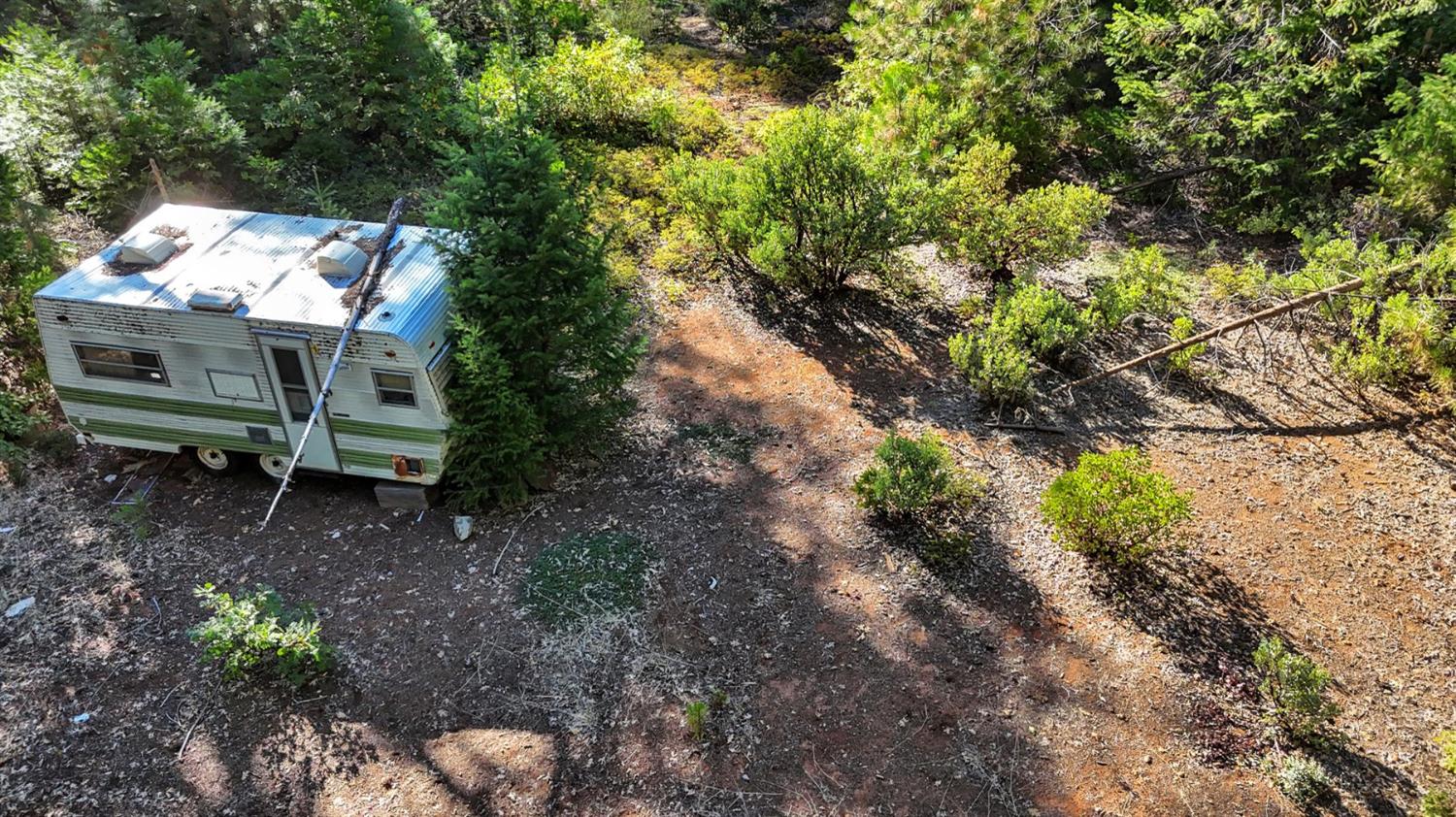 12683 Spider Hill Road Nevada City, CA 95959 - Photo 33 of 37 a backyard of a house with a yard and outdoor seating