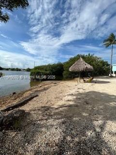 100 Morr Ln C5 Key Largo, FL 33037 - Photo 14 of 21 a view of a lake with a yard