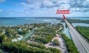 100 Morr Ln C5 Key Largo, FL 33037 - Photo 20 of 21 a view of a street with an ocean view