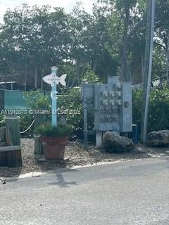 100 Morr Ln C5 Key Largo, FL 33037 - Photo 5 of 21 a front view of a house with a yard