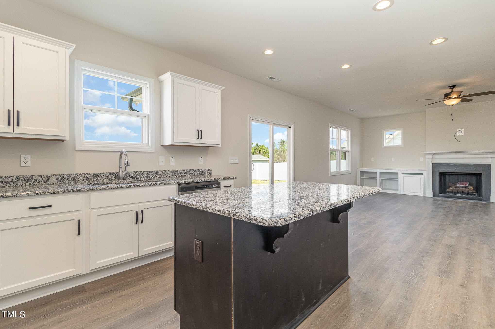 299 Jackson Pond Drive Smithfield, NC 27577 - Photo 14 of 25 a kitchen with granite countertop a sink a counter top space and cabinets