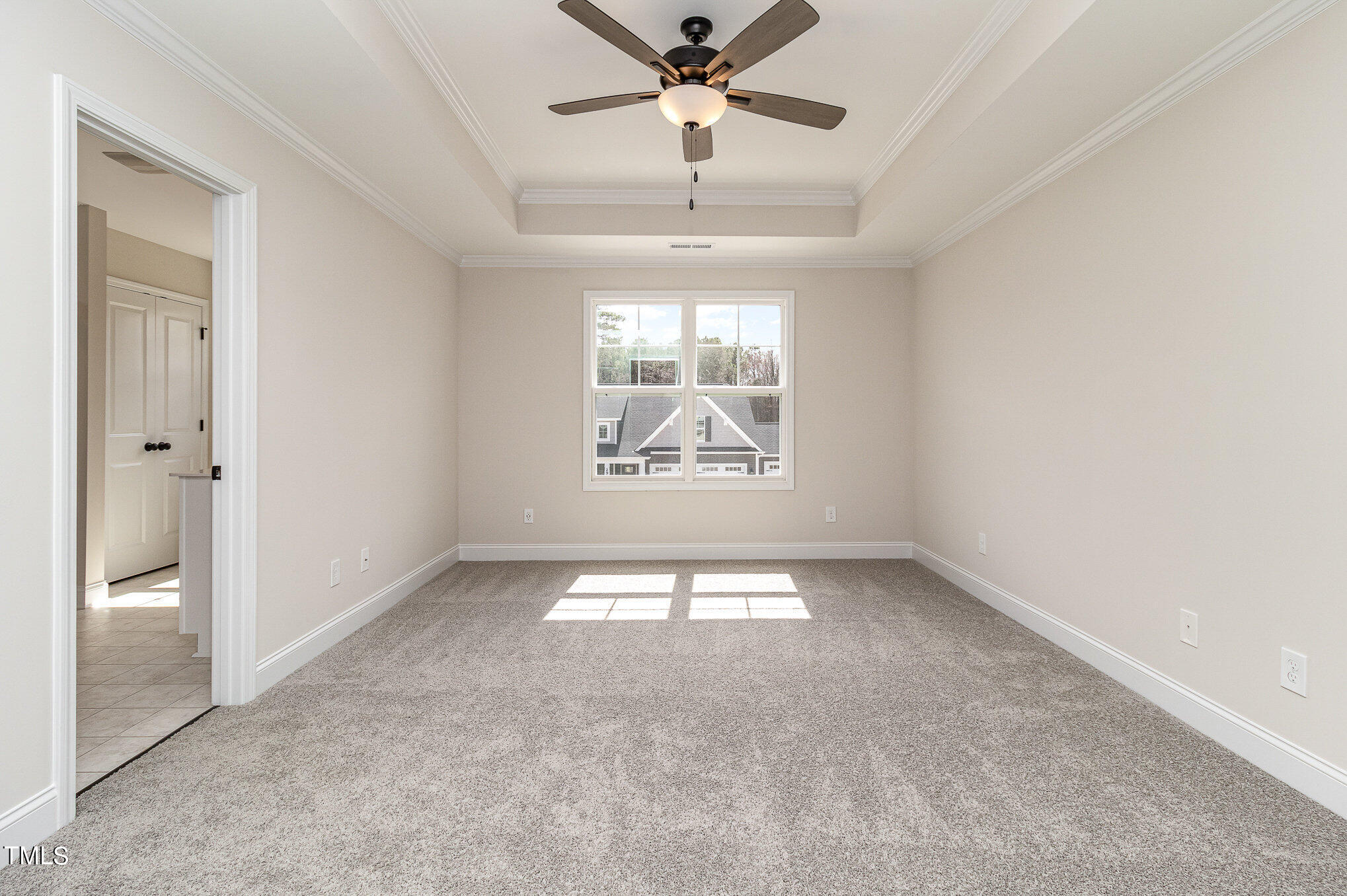 299 Jackson Pond Drive Smithfield, NC 27577 - Photo 16 of 25 an empty room with windows and ceiling fan