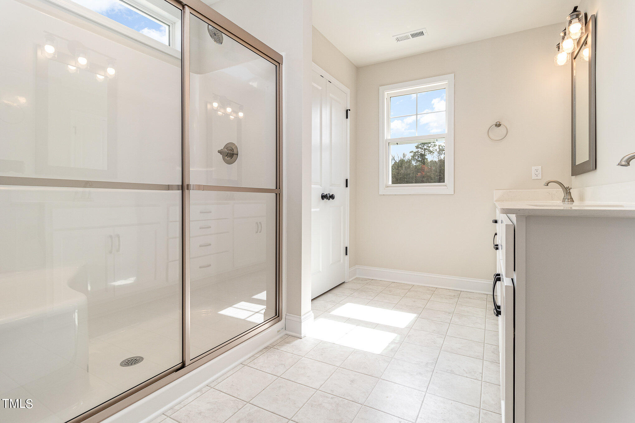 299 Jackson Pond Drive Smithfield, NC 27577 - Photo 18 of 25 a bathroom with a shower and a sink