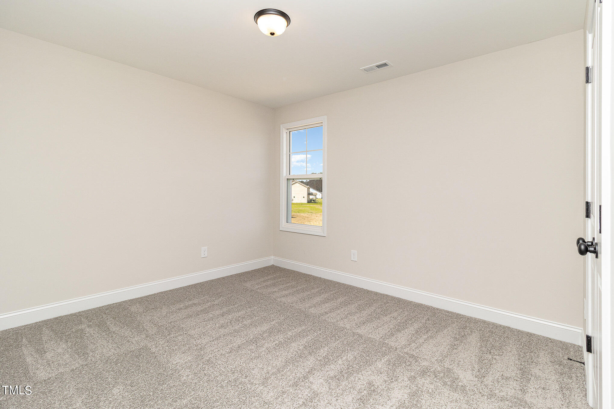 299 Jackson Pond Drive Smithfield, NC 27577 - Photo 20 of 25 an empty room with windows