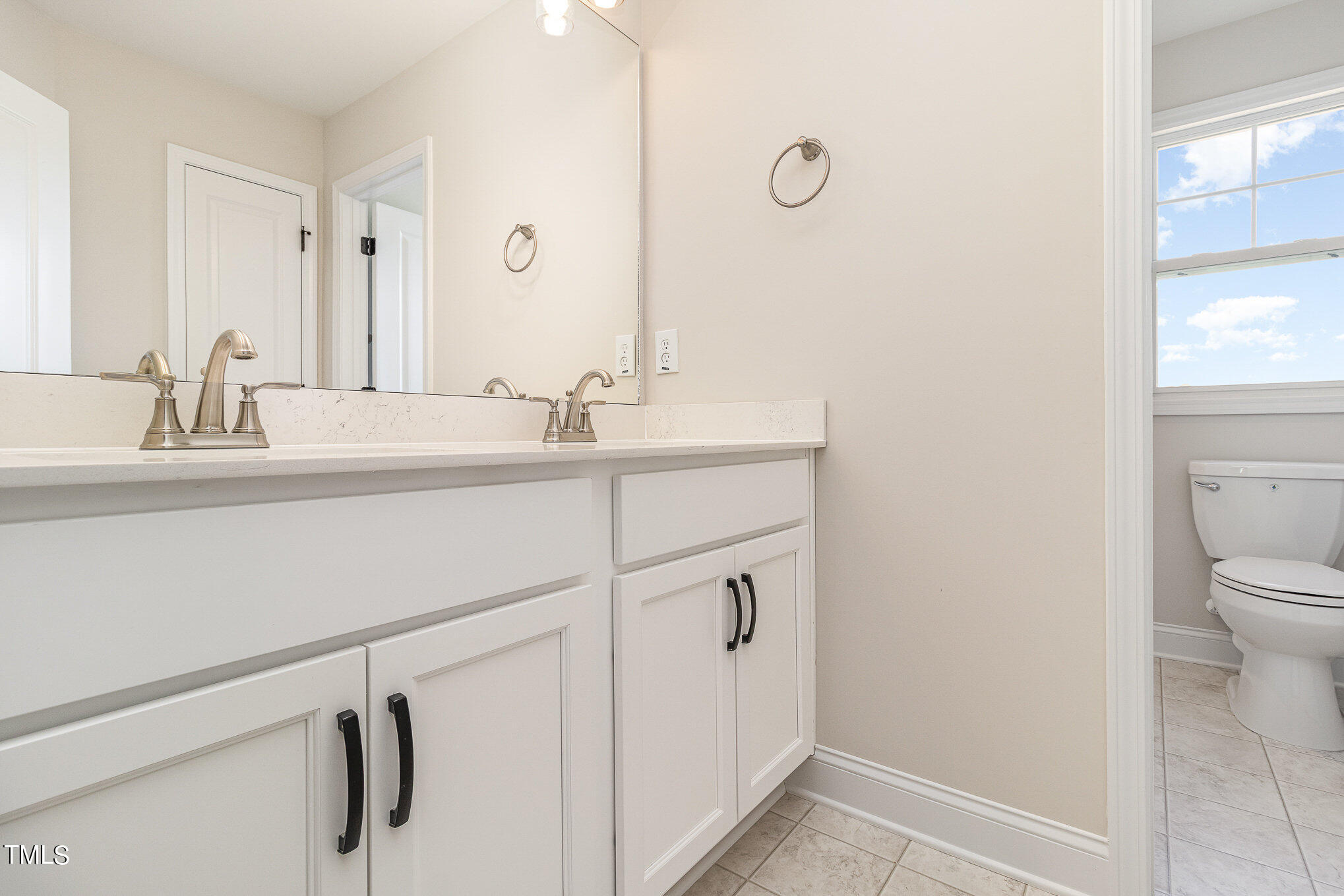 299 Jackson Pond Drive Smithfield, NC 27577 - Photo 22 of 25 a bathroom with a sink a toilet and a mirror