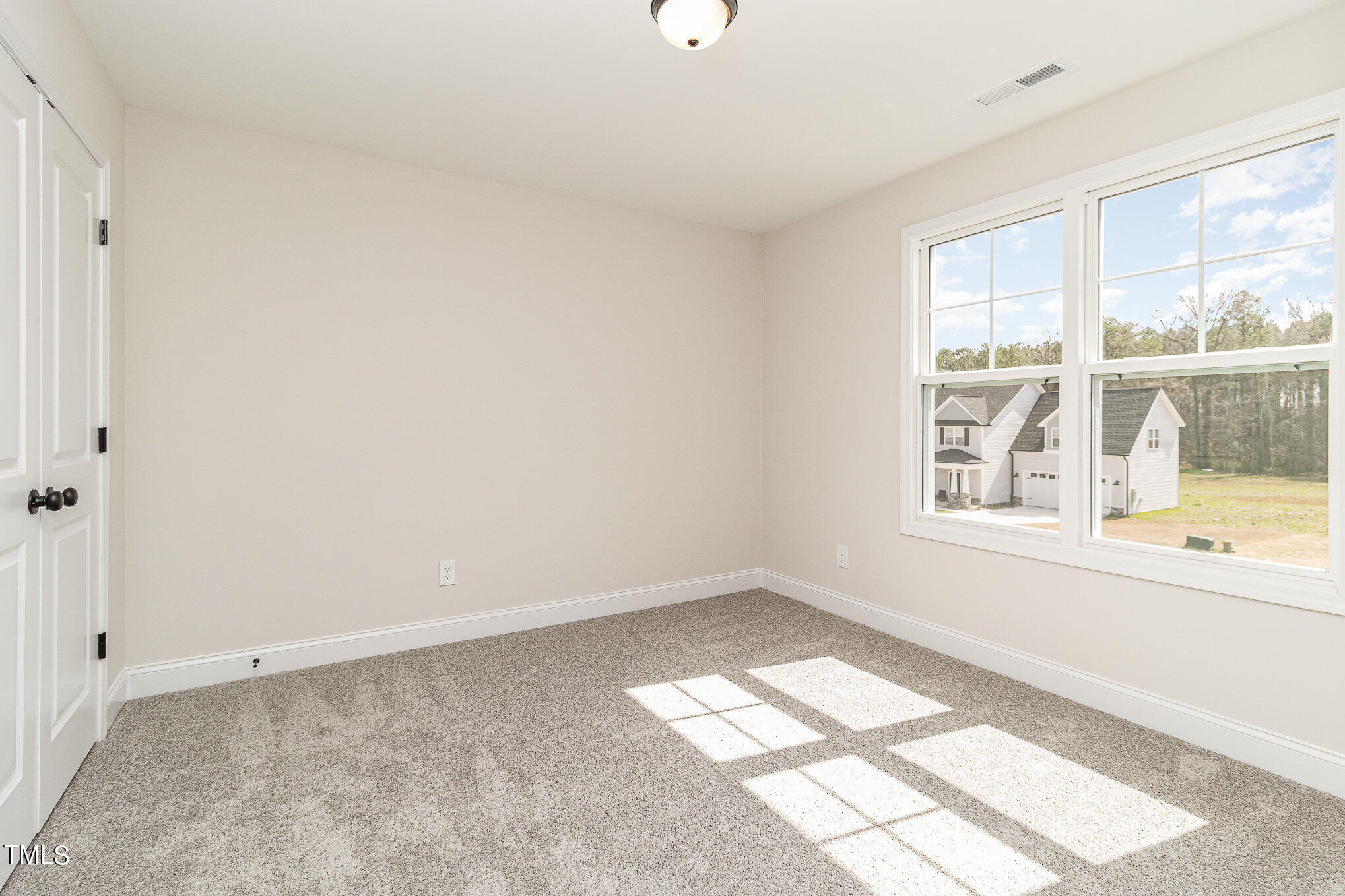 299 Jackson Pond Drive Smithfield, NC 27577 - Photo 24 of 25 a view of an empty room with a window