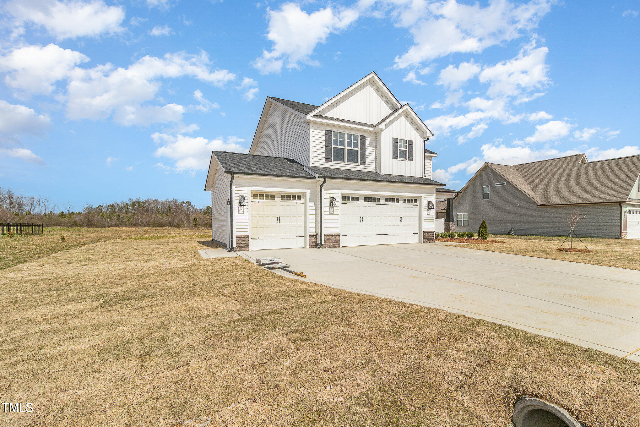 299 Jackson Pond Drive Smithfield, NC 27577 - Photo 3 of 25 front view of a house with a ocean view