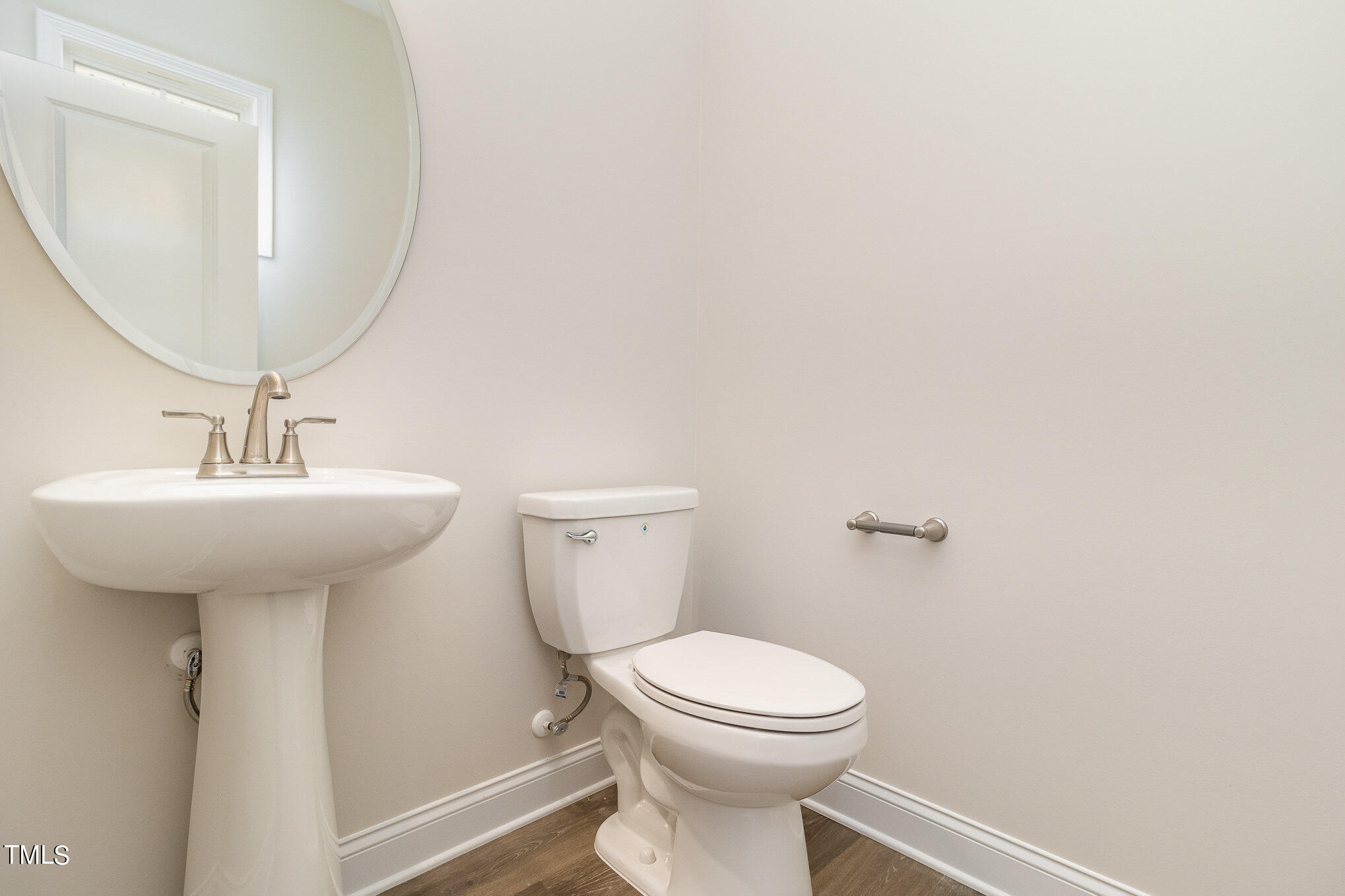 299 Jackson Pond Drive Smithfield, NC 27577 - Photo 6 of 25 a bathroom with a toilet sink and mirror