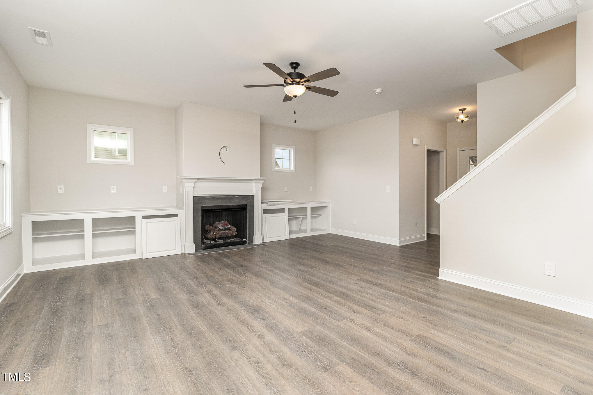 299 Jackson Pond Drive Smithfield, NC 27577 - Photo 7 of 25 a view of a livingroom with a fireplace and window