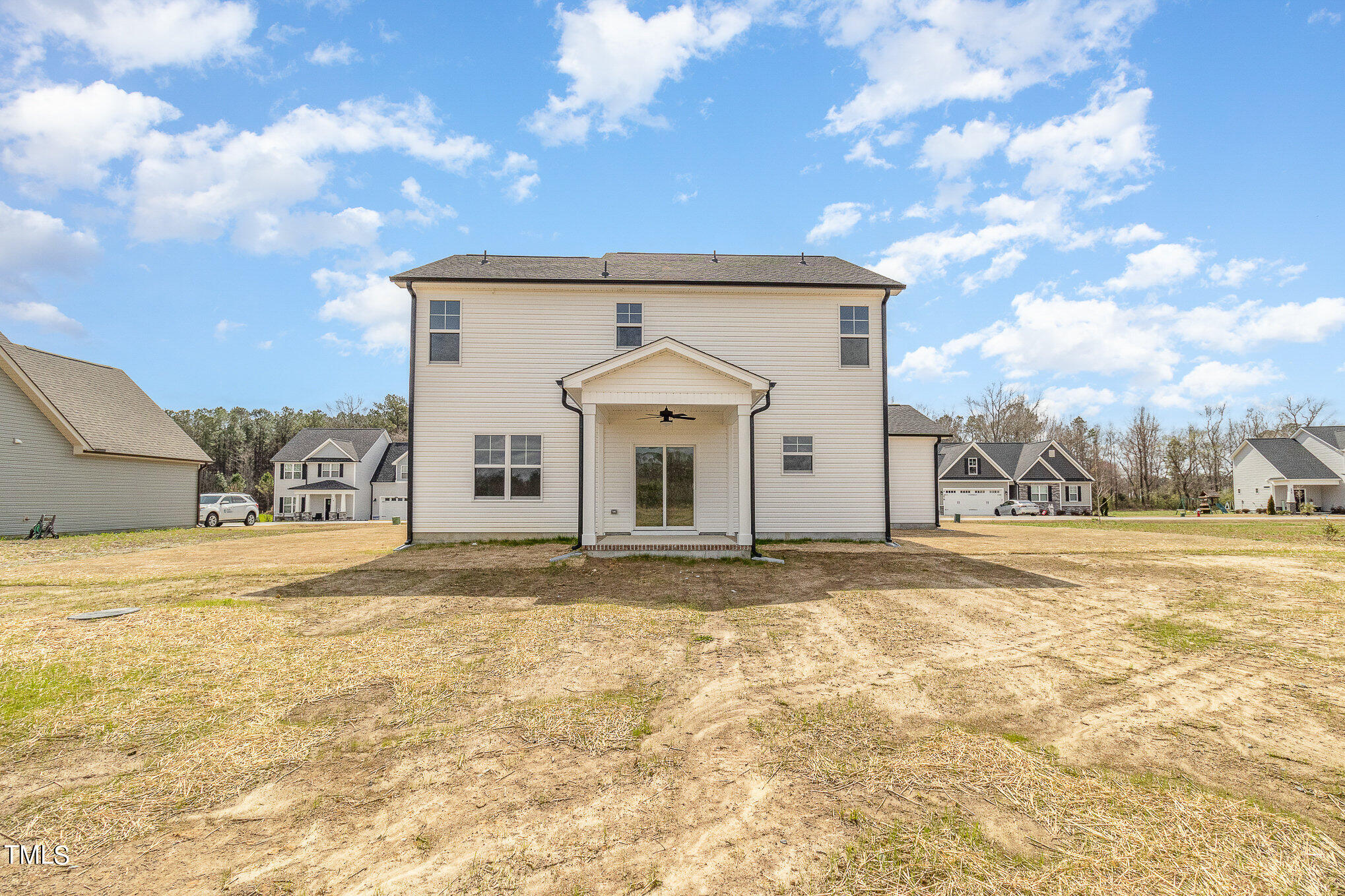 299 Jackson Pond Drive Smithfield, NC 27577 - Photo 8 of 25 a view of a house with a yard and garage