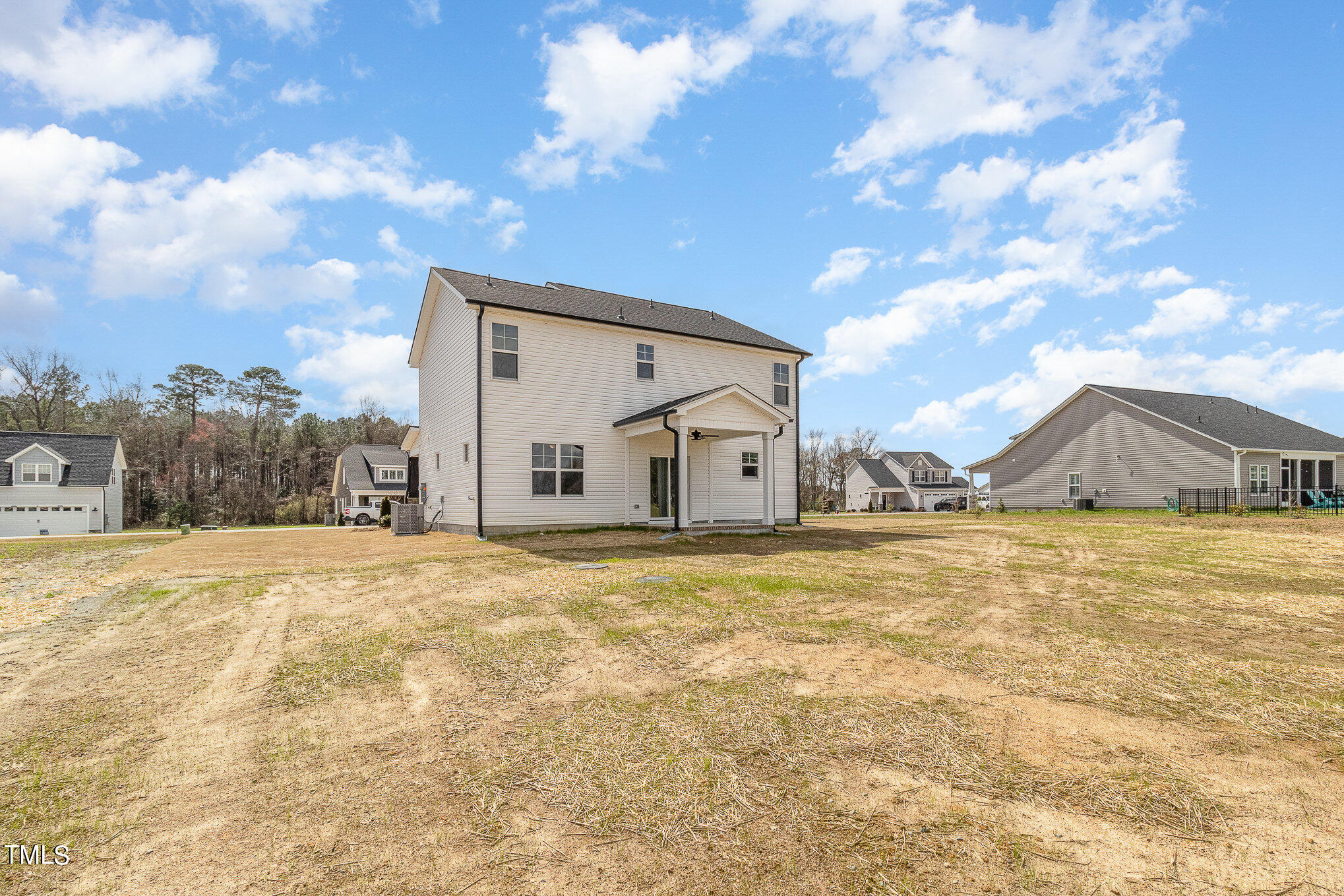 299 Jackson Pond Drive Smithfield, NC 27577 - Photo 10 of 25 a big house with a big yard and large trees