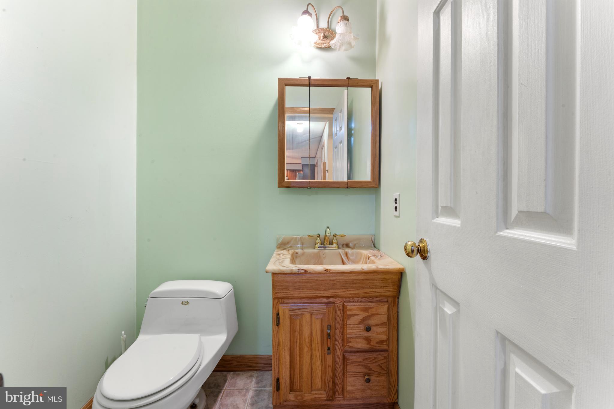 2015 Butternut Drive Huntingdon Valley, PA 19006 - Photo 24 of 40 a bathroom with a toilet sink and mirror