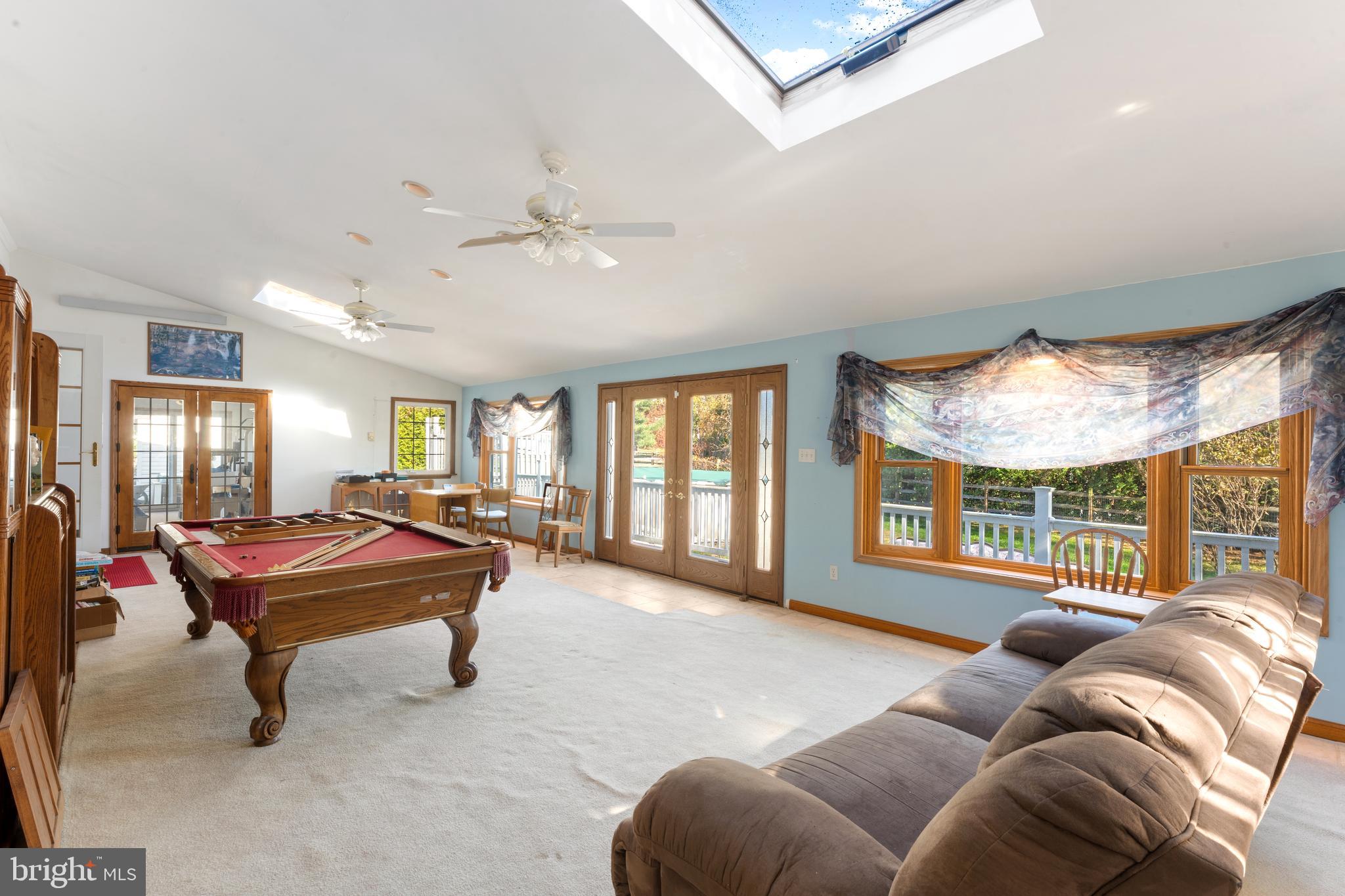 2015 Butternut Drive Huntingdon Valley, PA 19006 - Photo 28 of 40 a living room with furniture gym equipment and a large window