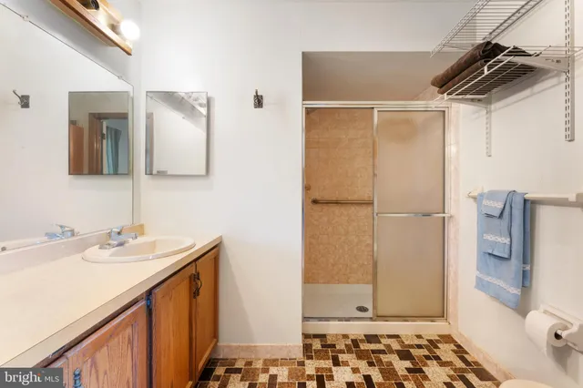 a bedroom with a bed couch and window