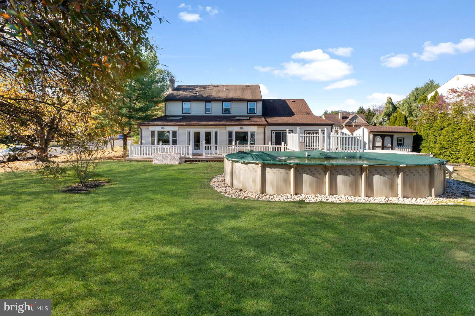 2015 Butternut Drive Huntingdon Valley, PA 19006 - Photo 6 of 40 a front view of a house with a garden and trees