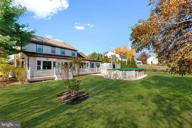 a view of a house with a yard porch and sitting area