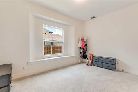 a view of a livingroom with toys and a window