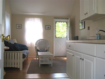 200 Pilgrim Spring Road, Unit B Wellfleet, MA 02667 - Photo 2 of 13 a room with a couch and a window