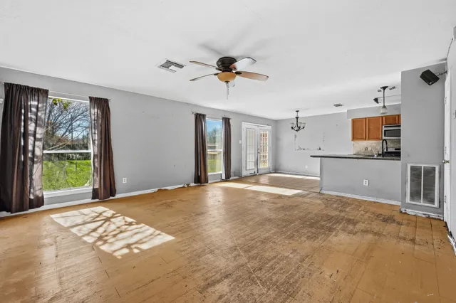 a view of a kitchen with a sink and a window