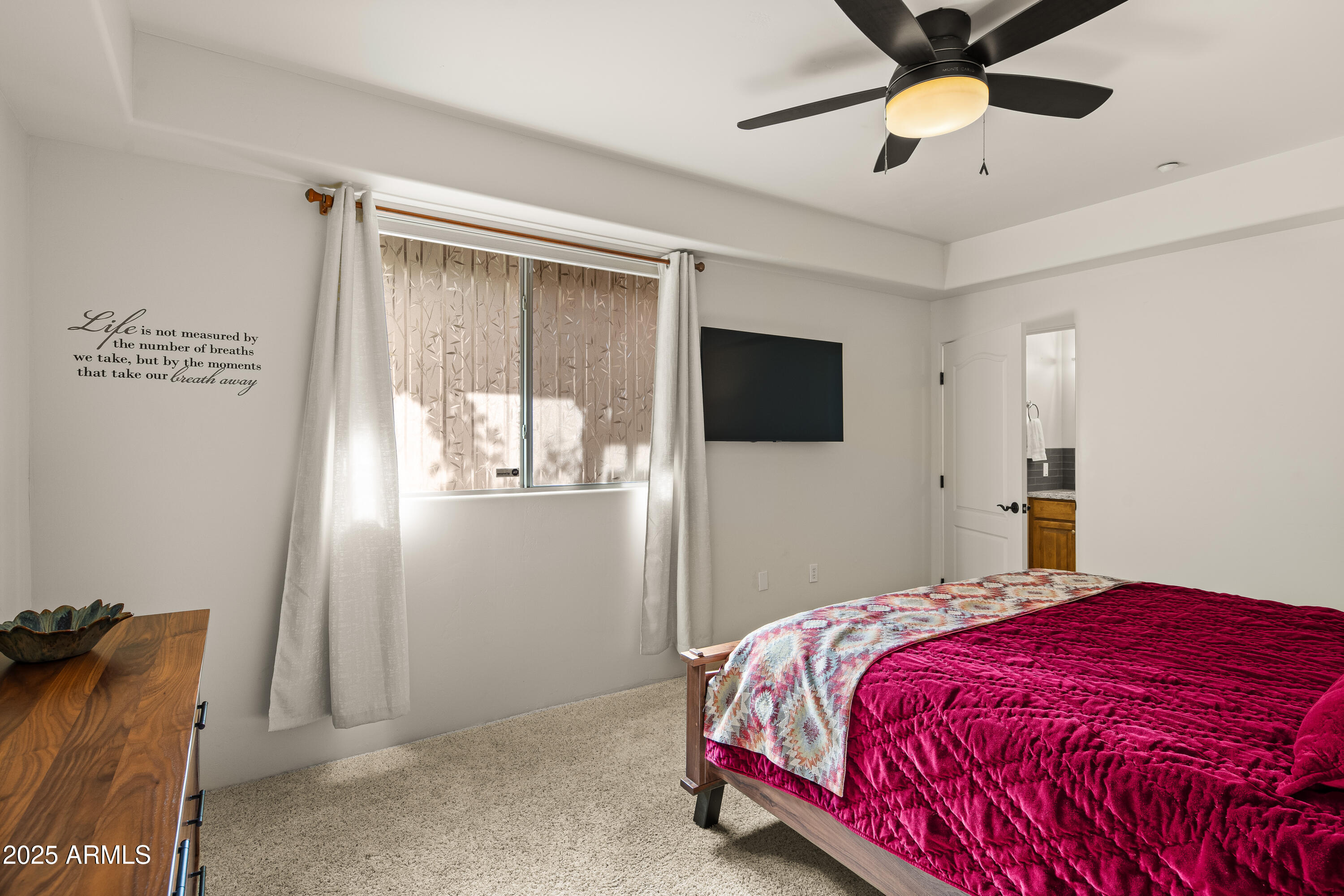 520 Jordan Road, Unit 2 Sedona, AZ 86336 - Photo 11 of 34 a bedroom with a bed and a flat tv screen