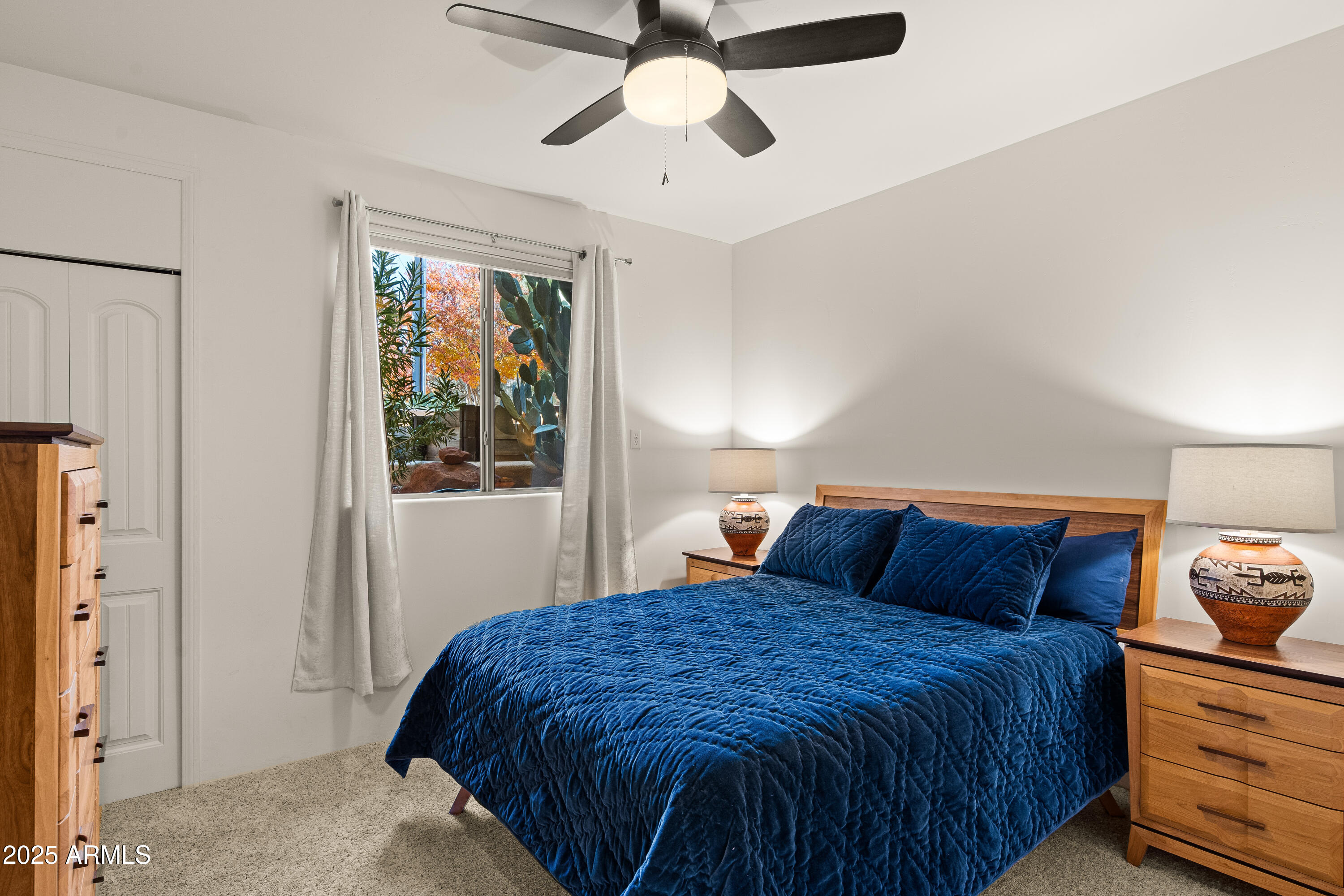 520 Jordan Road, Unit 2 Sedona, AZ 86336 - Photo 17 of 34 a bedroom with a bed and a window