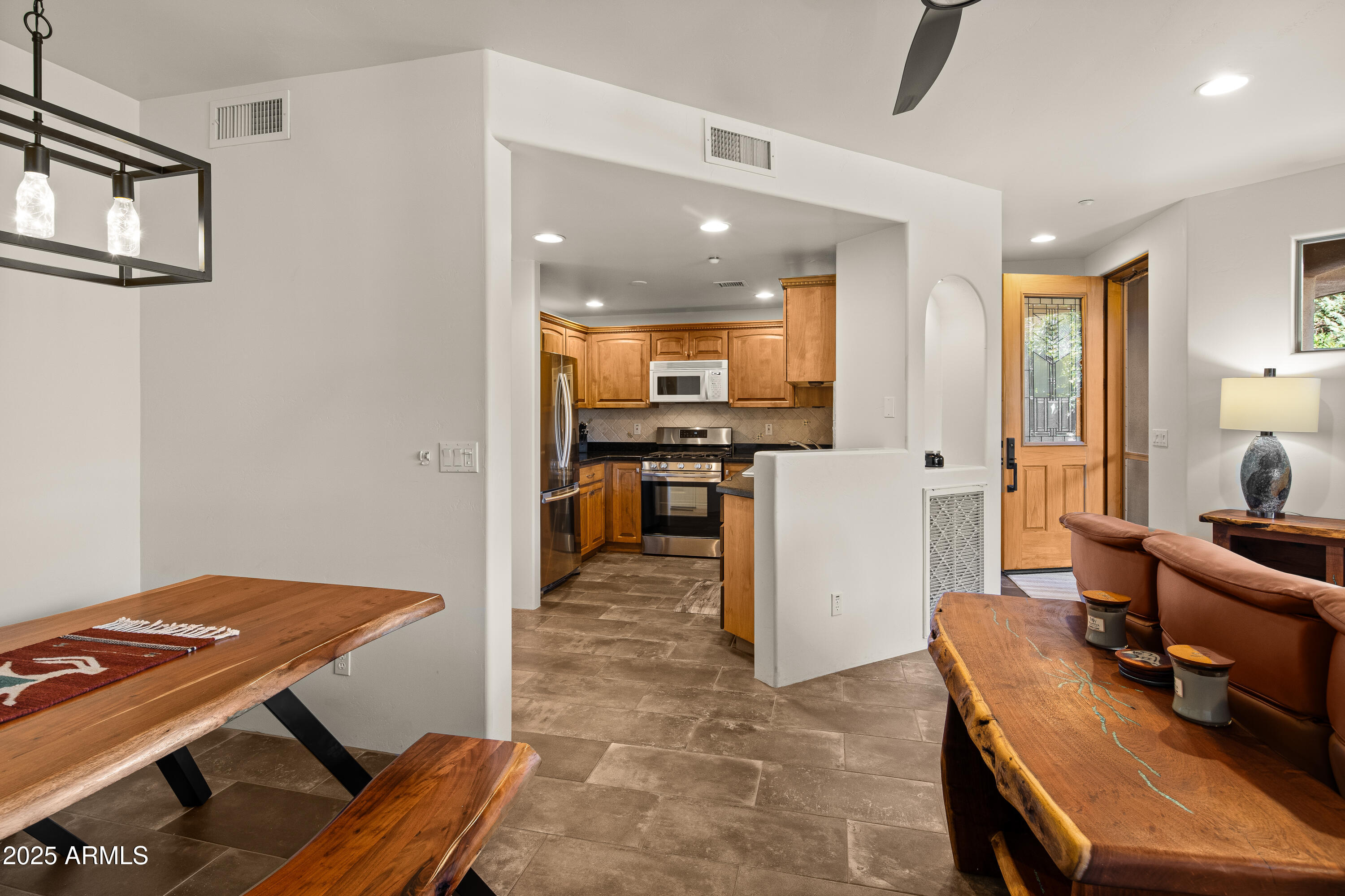 520 Jordan Road, Unit 2 Sedona, AZ 86336 - Photo 8 of 34 a living room with furniture and a table