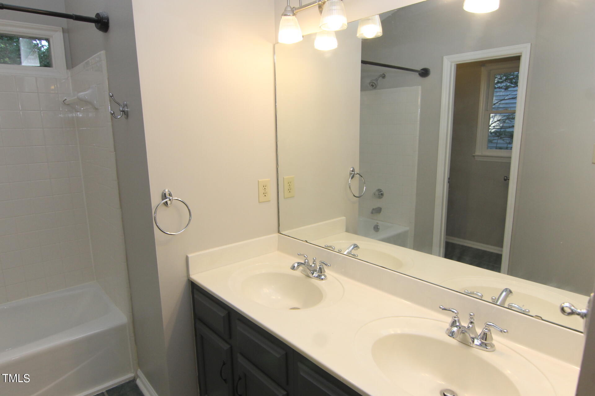 3313 Singleleaf Lane Raleigh, NC 27616 - Photo 13 of 25 a bathroom with a sink and a mirror