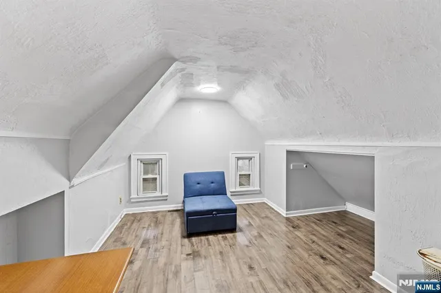 a living room with furniture and a lamp