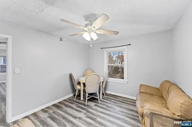 a workspace room with furniture and a window