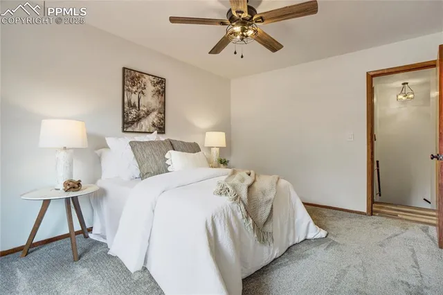 a bed room with a bed and a lamp