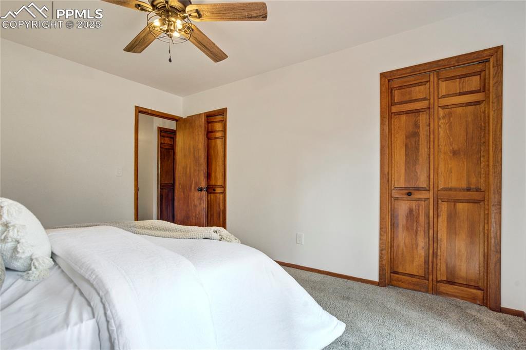 57 Aspen Circle Divide, CO 80814 - Photo 17 of 50 a bedroom with a bed and a chandelier