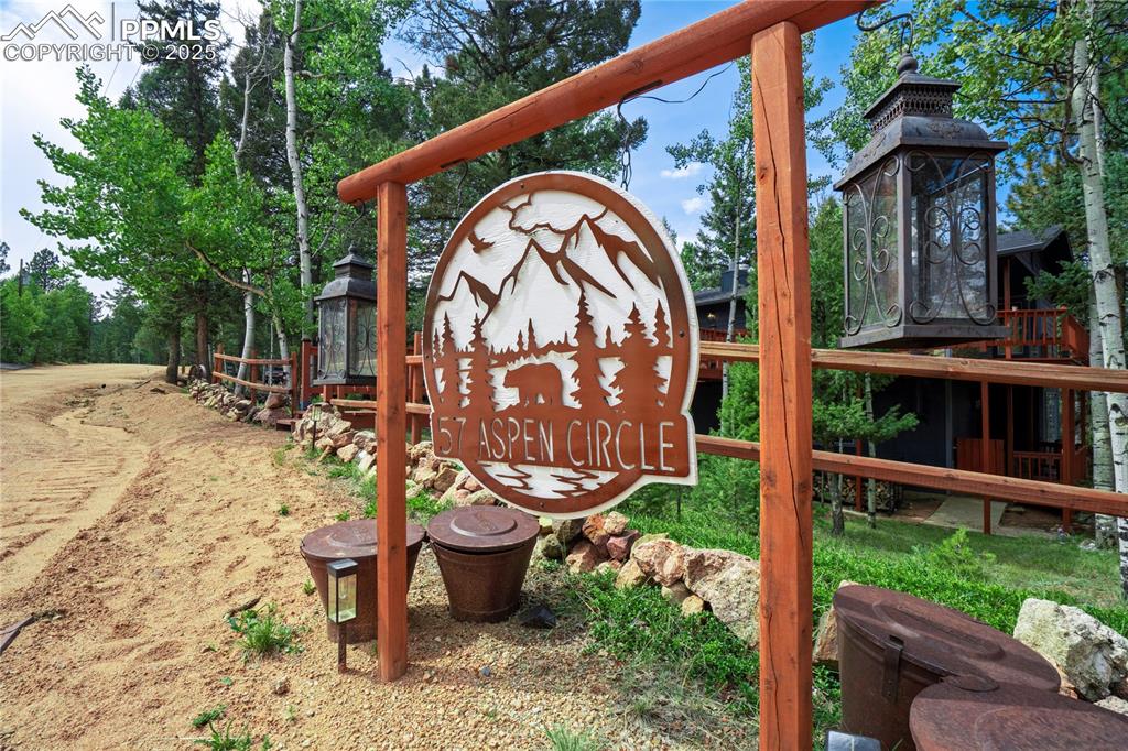 57 Aspen Circle Divide, CO 80814 - Photo 2 of 50 a wooden bench sitting in front of a building