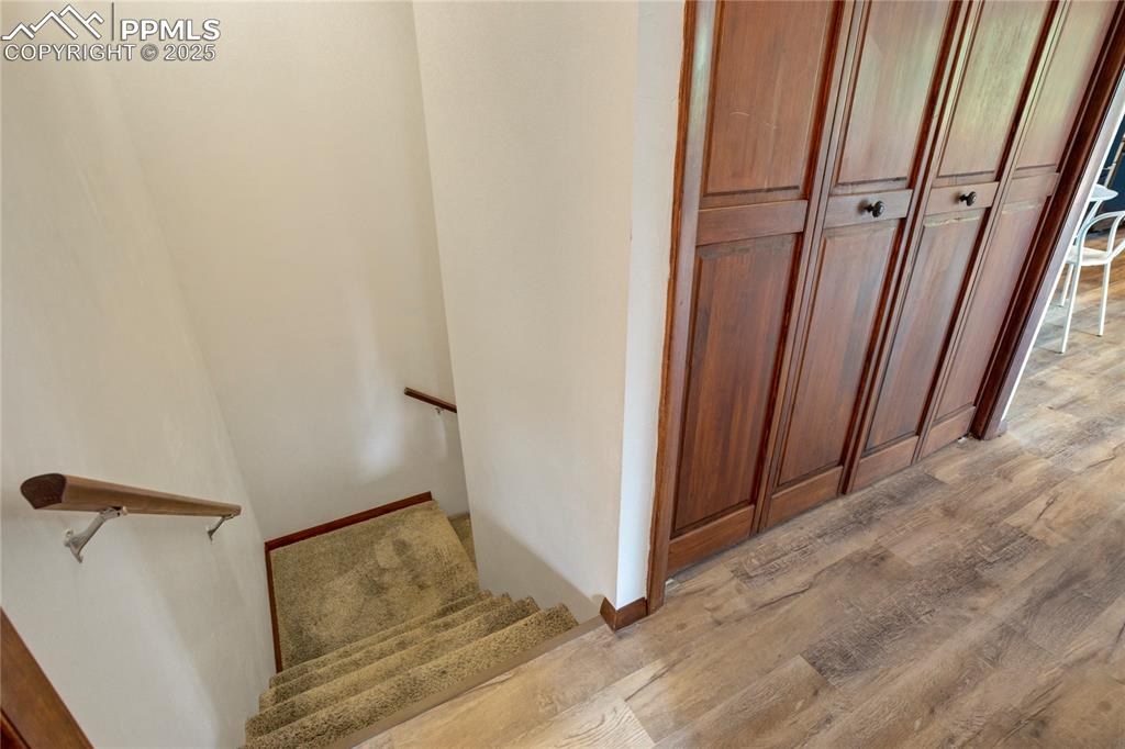 57 Aspen Circle Divide, CO 80814 - Photo 21 of 50 a view of a hallway with wooden floor and staircase