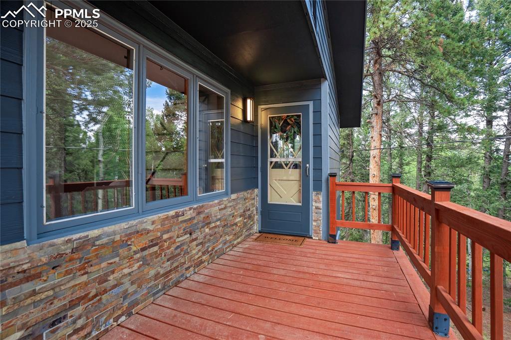57 Aspen Circle Divide, CO 80814 - Photo 5 of 50 a view of a room with wooden floor and wooden fence