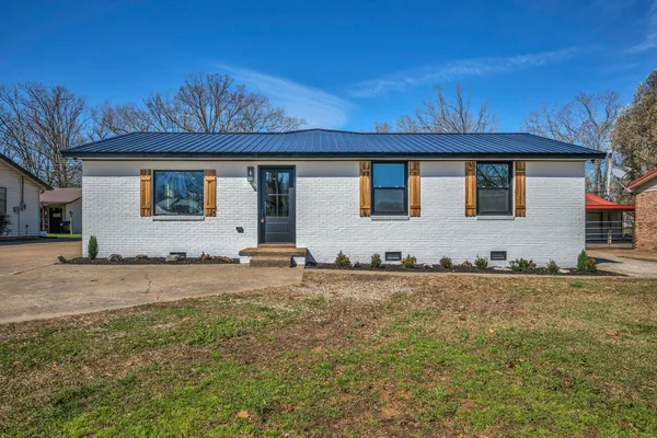 a kitchen with a refrigerator stove and microwave