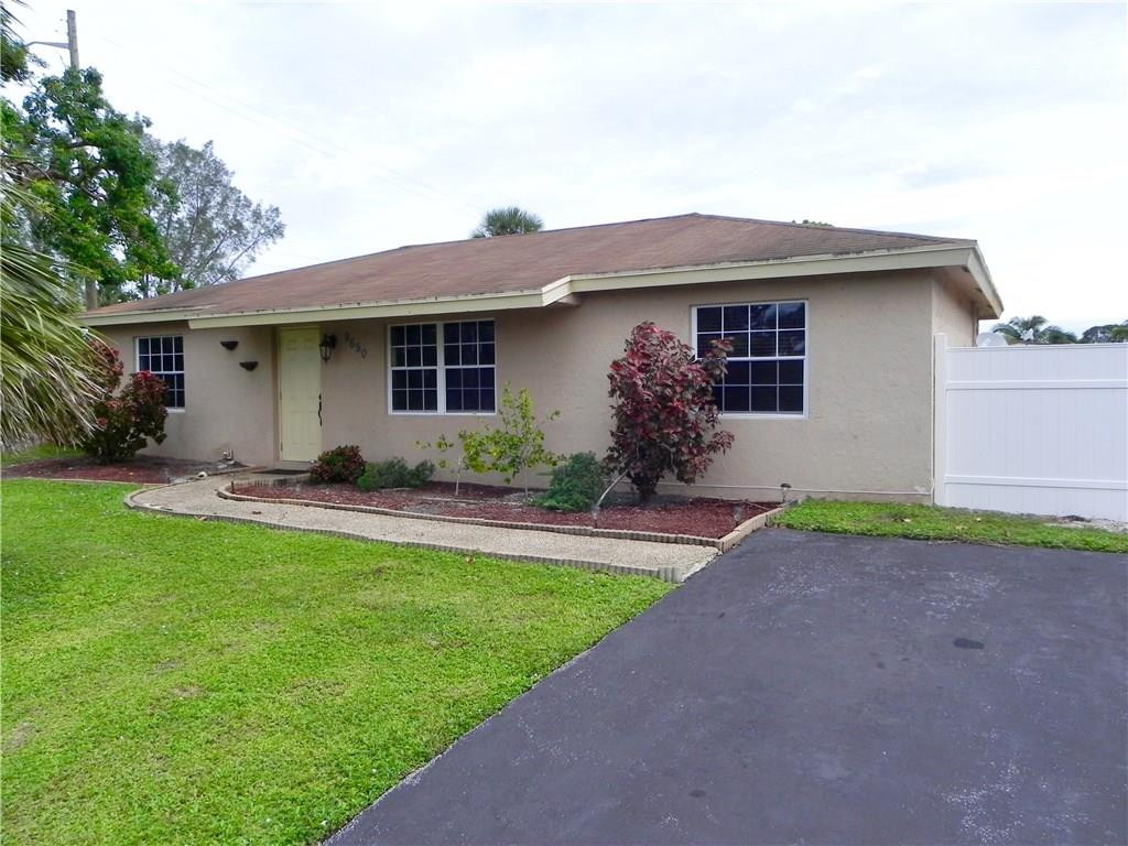 9650 Colorado Court Boca Raton, FL 33434 - Photo 1 of 14 a front view of house with yard and green space