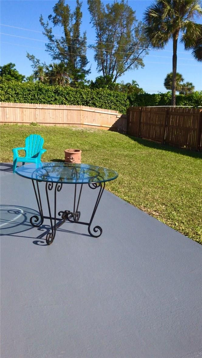9650 Colorado Court Boca Raton, FL 33434 - Photo 13 of 14 a view of a swimming pool with an outdoor seating and yard