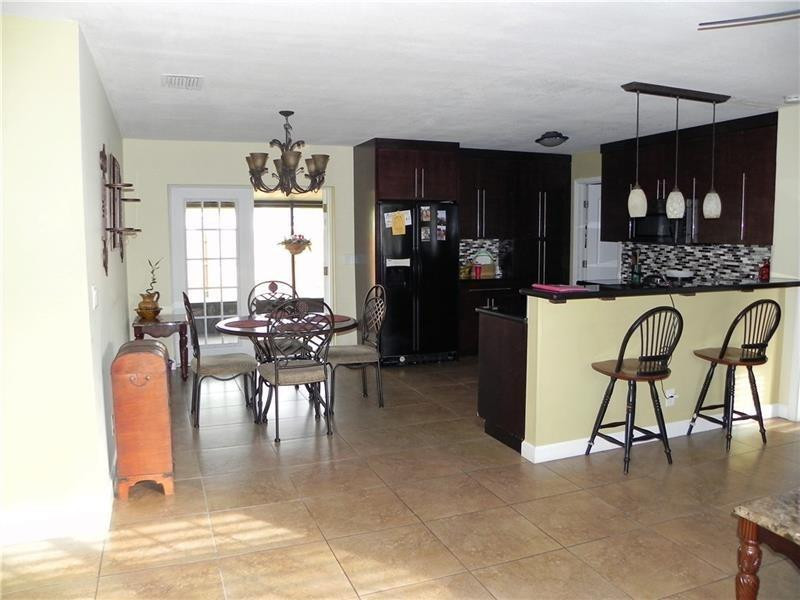 9650 Colorado Court Boca Raton, FL 33434 - Photo 5 of 14 a view of a dining room with furniture