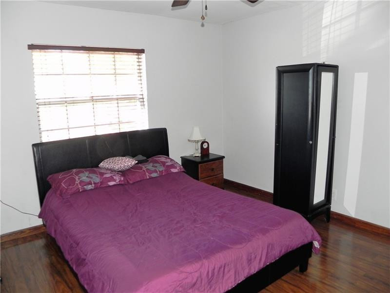 9650 Colorado Court Boca Raton, FL 33434 - Photo 7 of 14 a bedroom with a bed and a window