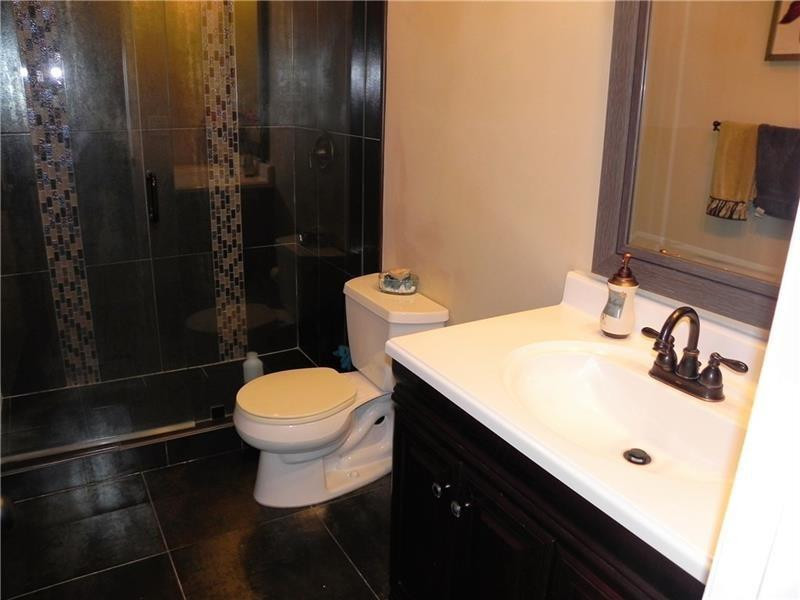 9650 Colorado Court Boca Raton, FL 33434 - Photo 9 of 14 a bathroom with a sink toilet and shower