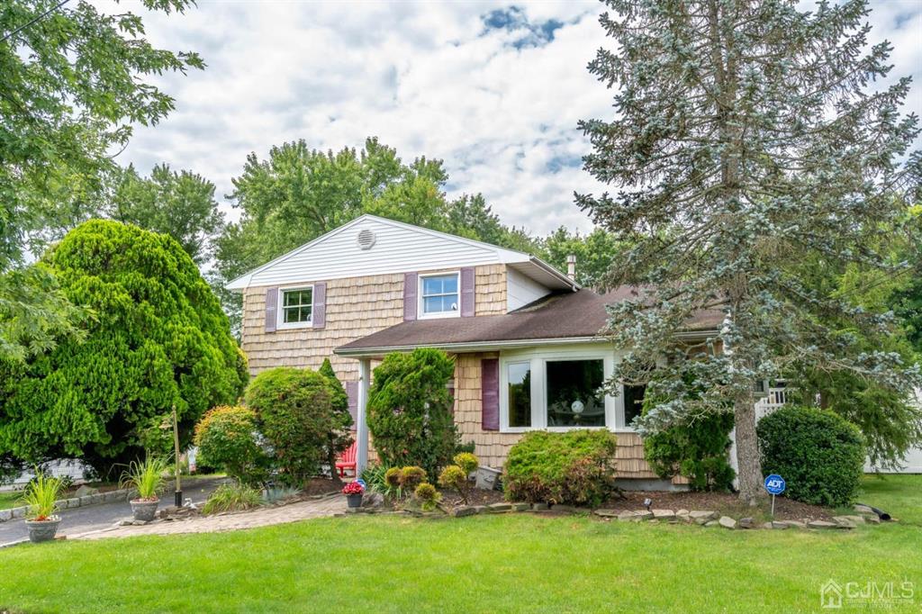 16 Hansen Road Old Bridge, NJ 08857 - Photo 1 of 32 a front view of house with yard and green space