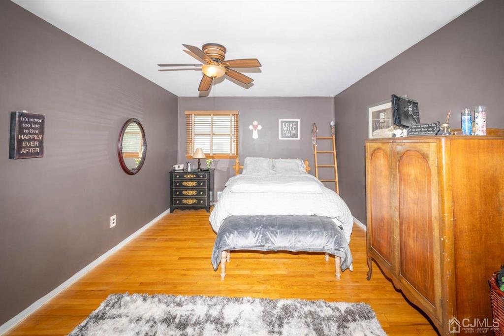 16 Hansen Road Old Bridge, NJ 08857 - Photo 17 of 32 a spacious bedroom with a bed and a chandelier