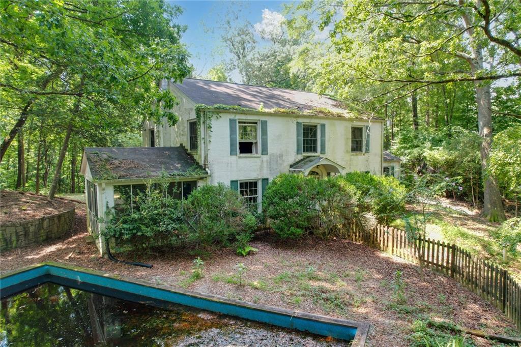 1700 West Paces Ferry Road Northwest Atlanta, GA 30327 - Photo 4 of 6 a view of a house with a yard