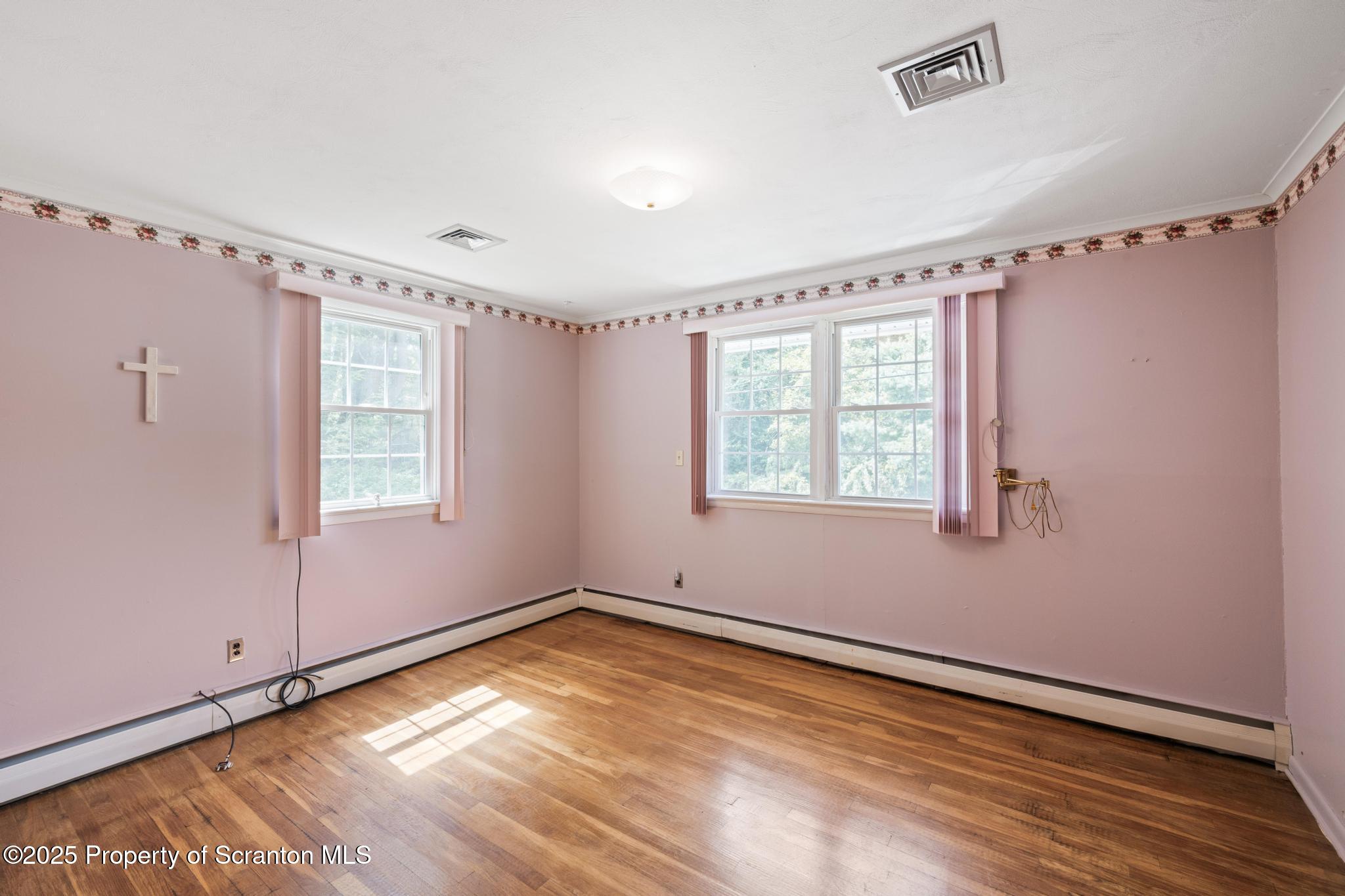 378 Gravel Pond Road Clarks Summit, PA 18411 - Photo 20 of 30 a view of empty room with wooden floor and fan