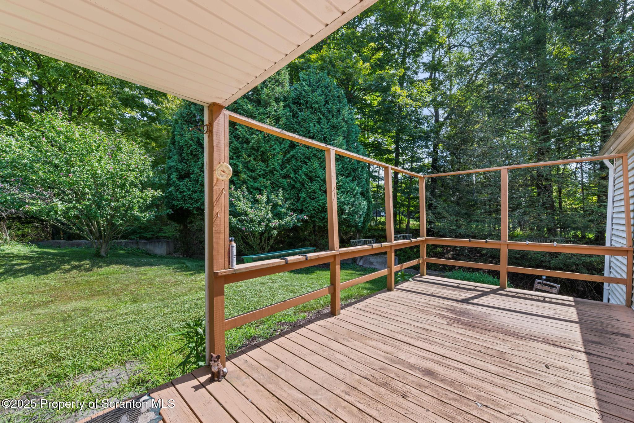 378 Gravel Pond Road Clarks Summit, PA 18411 - Photo 25 of 30 a view of a deck with a yard