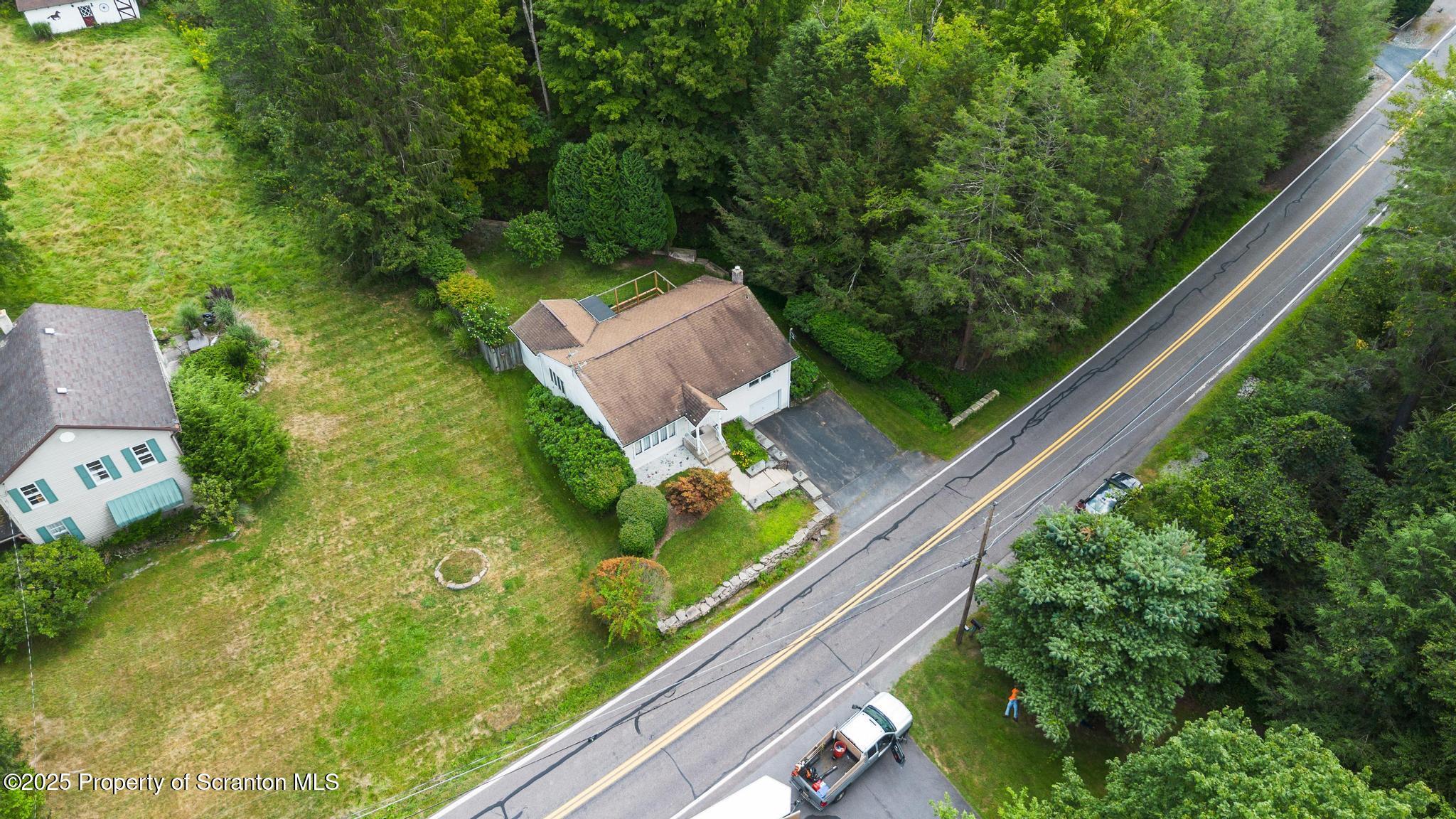 378 Gravel Pond Road Clarks Summit, PA 18411 - Photo 28 of 30 a view of a garden from a balcony