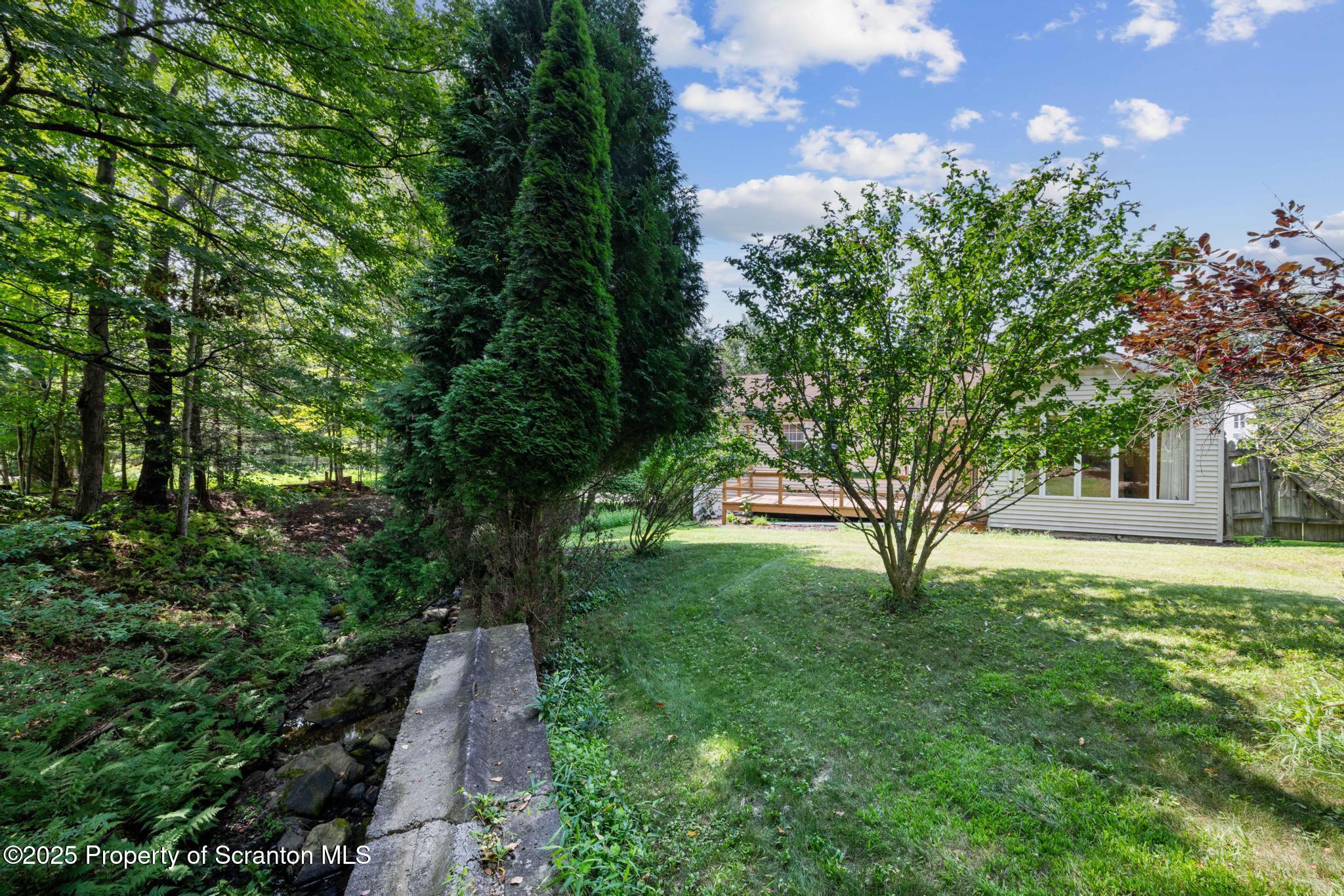 378 Gravel Pond Road Clarks Summit, PA 18411 - Photo 4 of 30 a view of a backyard with garden