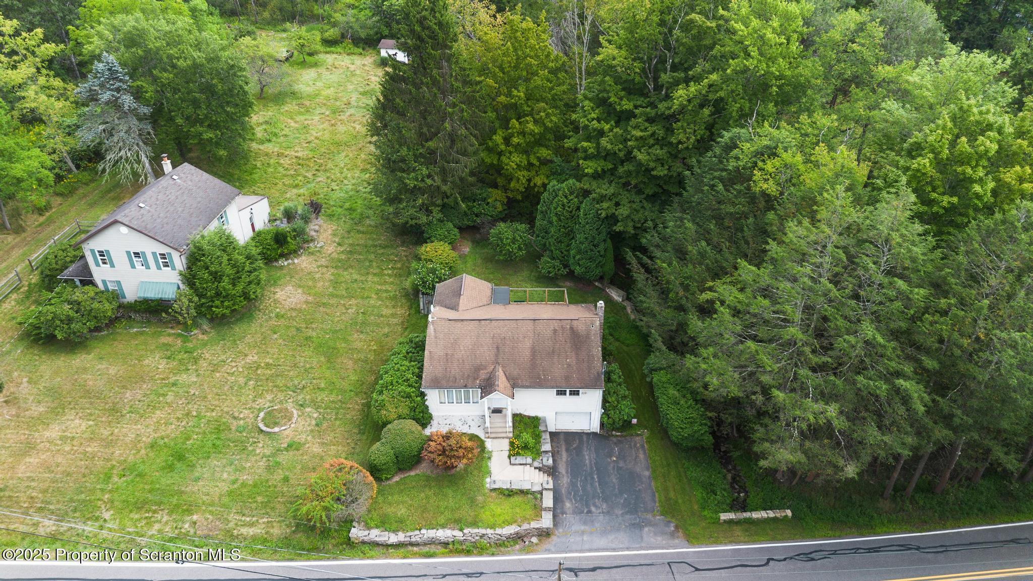 378 Gravel Pond Road Clarks Summit, PA 18411 - Photo 5 of 30 an aerial view of a house with garden space and street view