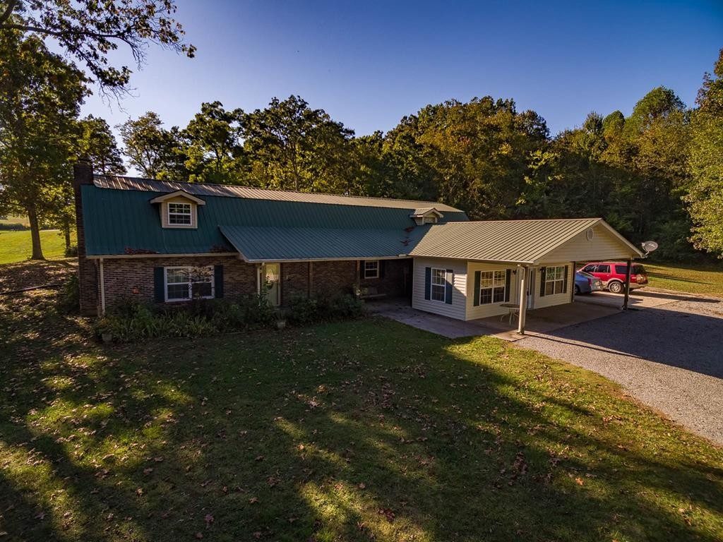 3520 Blue Springs Road Sweetwater, TN 37874 - Photo 1 of 49 a house view with a garden space